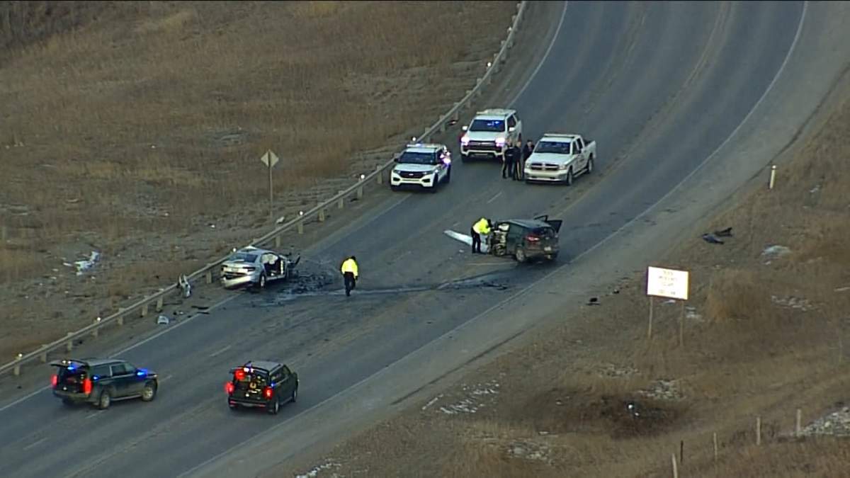 A serious two-vehicle crash on Highway 1A, just east of Cochrane, has sent two people to hospital and forced police to shut down the road.