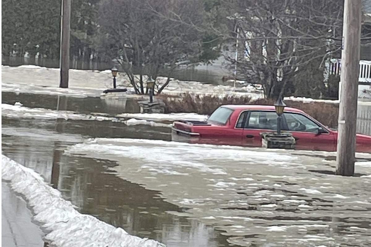 A photo posted by the municipality of Drummondville shows a car partially submerged in floodwaters.