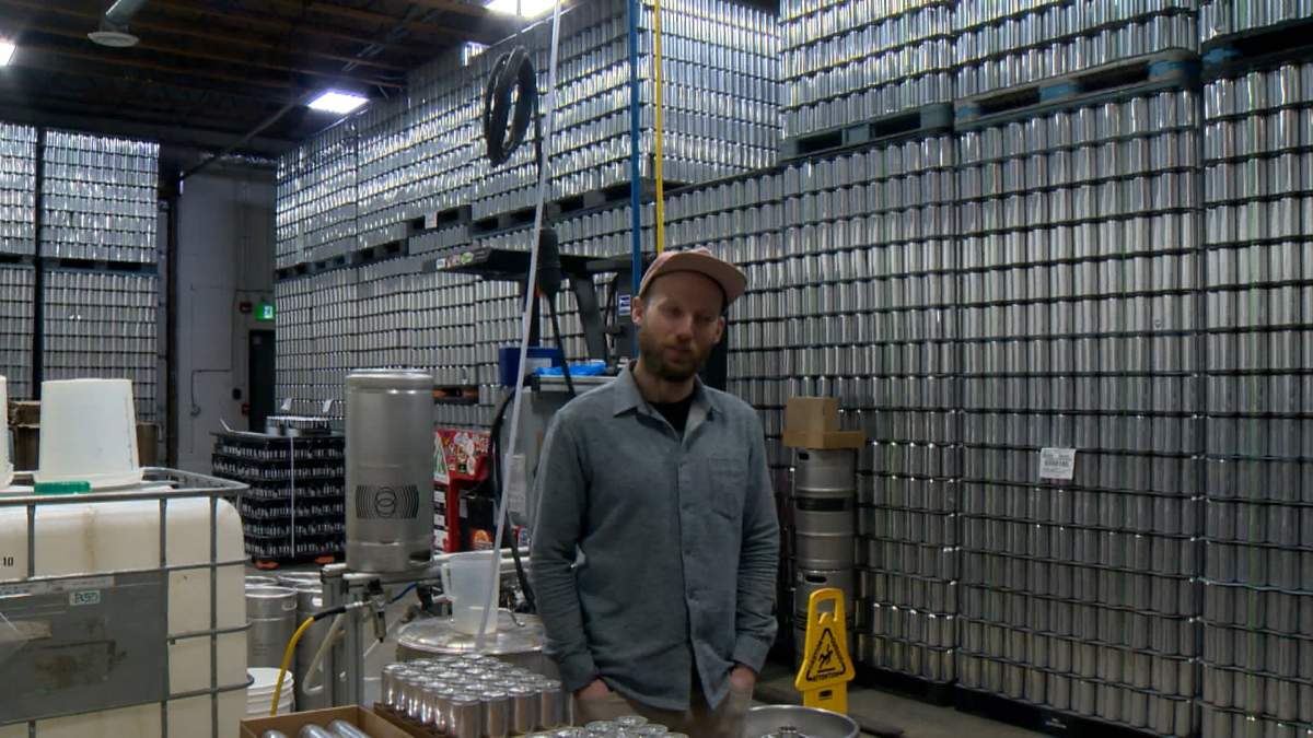Brandon Hart, owner of The Establishment Brewing Company in Calgary has stockpiled 300,000 aluminum cans, enough to avoid several months of Trump's new tariffs.