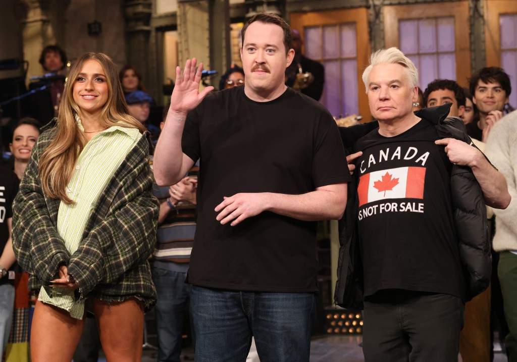 Musical guest Tate McRae of Calgary, host Shane Gillis, and special guest Mike Myers during say their goodnights after appearing on Saturday Night Live on March 1, 2025.