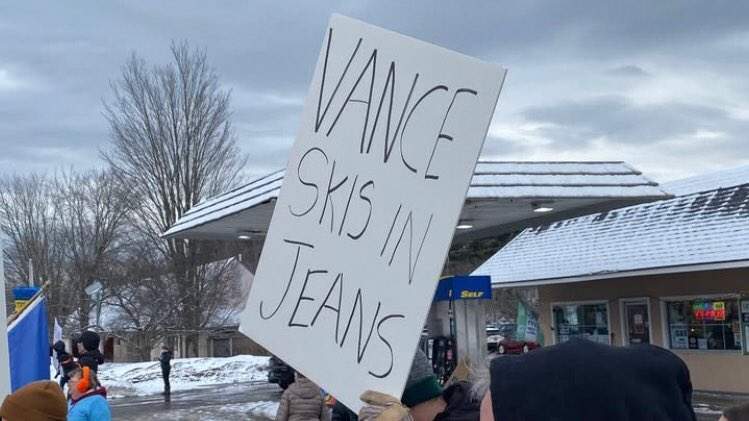 Protester holds up a sign in Waitsfield, VT at pro-Ukraine rally.