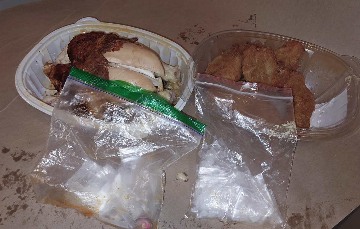 Drugs found concealed in a rotisserie chicken after a man was arrested for threatening hotel staff in Kingston.