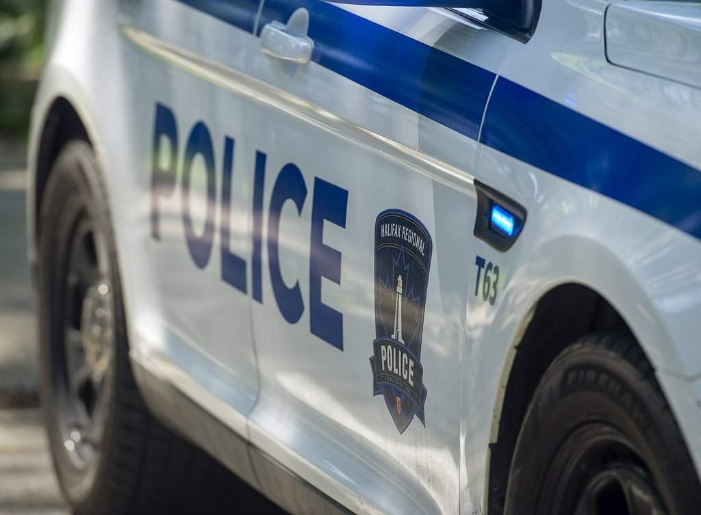 Police officers attend a scene in Halifax.