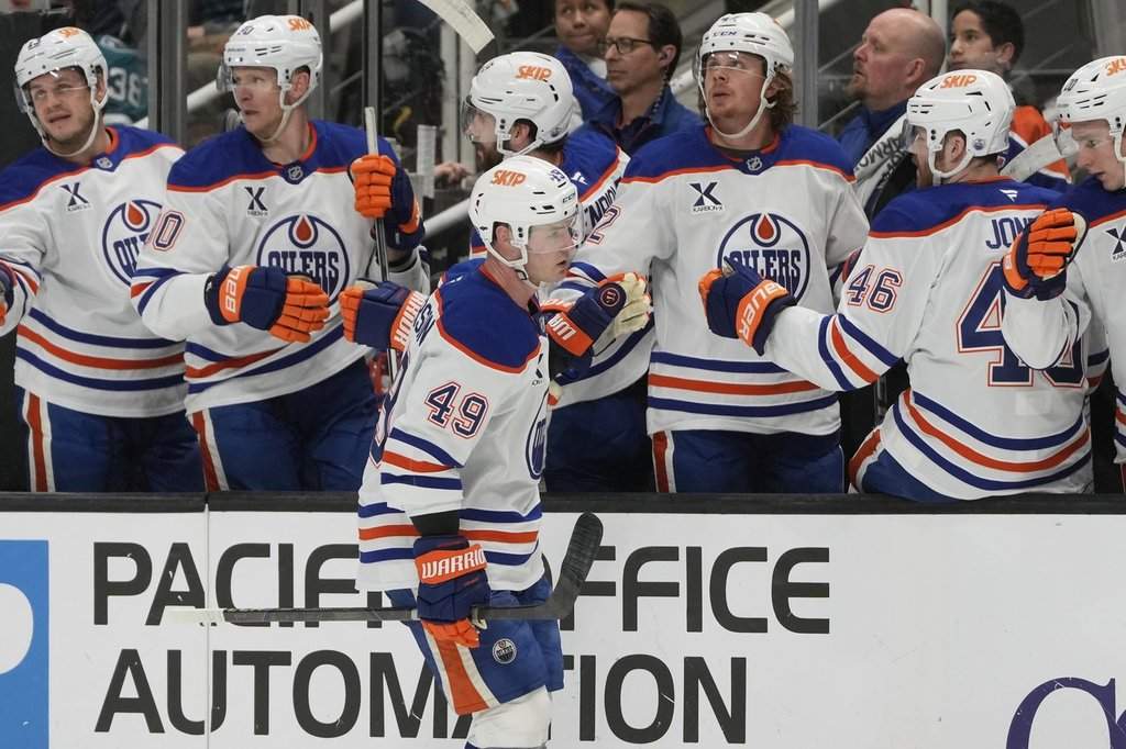 Edmonton Oilers defenceman Ty Emberson (49) is congratulated by teammates after scoring against the San Jose Sharks during the first period of an NHL hockey game in San Jose, Calif., Wednesday, April 16, 2025.