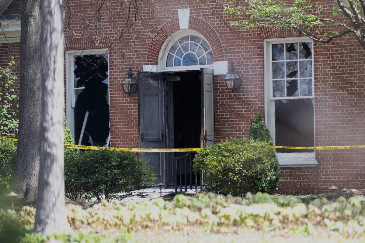 The windows and door is damaged from an overnight fire at the governor’s official residence on Sunday, April 13, 2025 in Harrisburg, Pa. (AP Photo/Marc Levy)