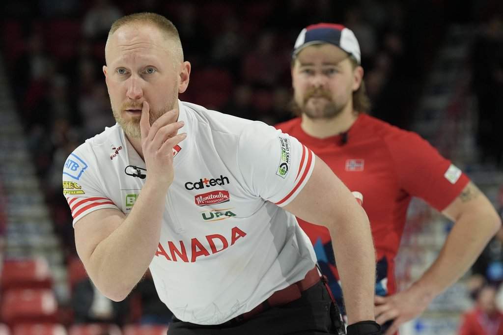 Canada skip Brad Jacobs watches his stone as Norway's Martin Sesaker looks on at the BKT World Men's Curling Championship in Moose Jaw, Sask., on Wednesday, April 2, 2025.