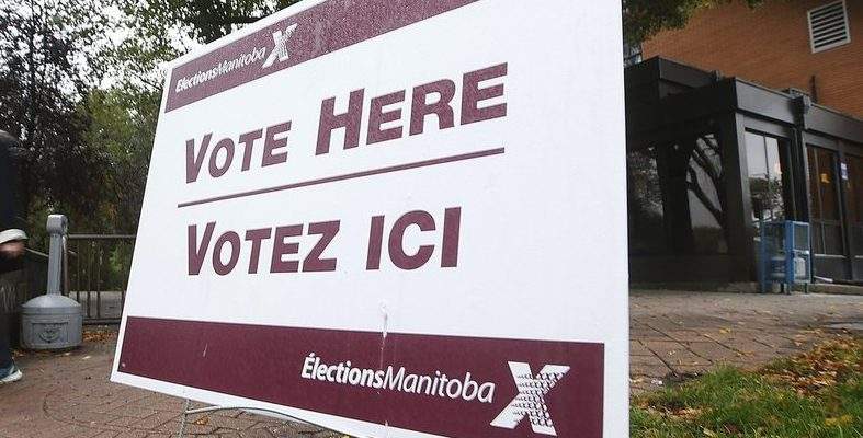 An election sign is seen outside a polling station in this file photo. 