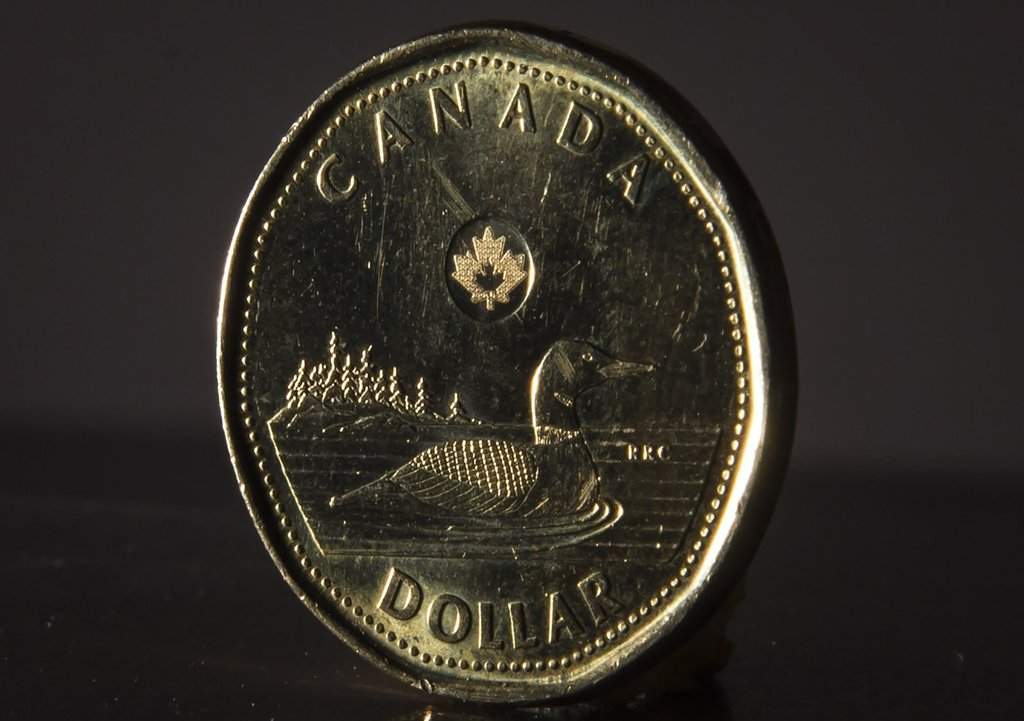 <p>The Canadian dollar coin is pictured in North Vancouver, B.C. Wednesday, May 29, 2019. THE CANADIAN PRESS/Jonathan Hayward</p>.
