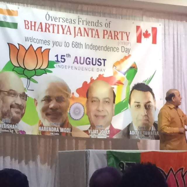 Banner at 2014 Overseas Friends of BJP event features Aditya Tawatia, now a Conservative donor, on right.