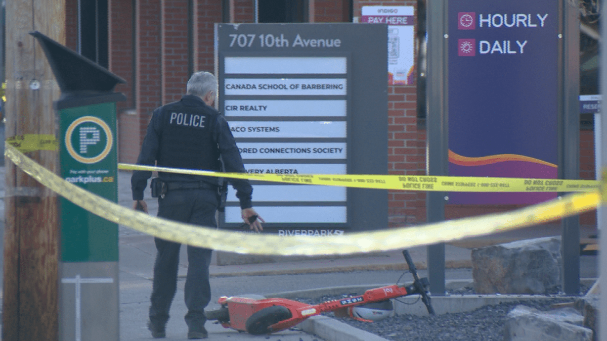 Forensic investigator surveys a crime scene