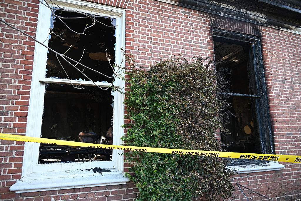 Police line cordon is seen at Pennsylvania Governor's Mansion after a suspected arson attack caused significant damage in Harrisburg, Pennsylvania, on April 13, 2025.