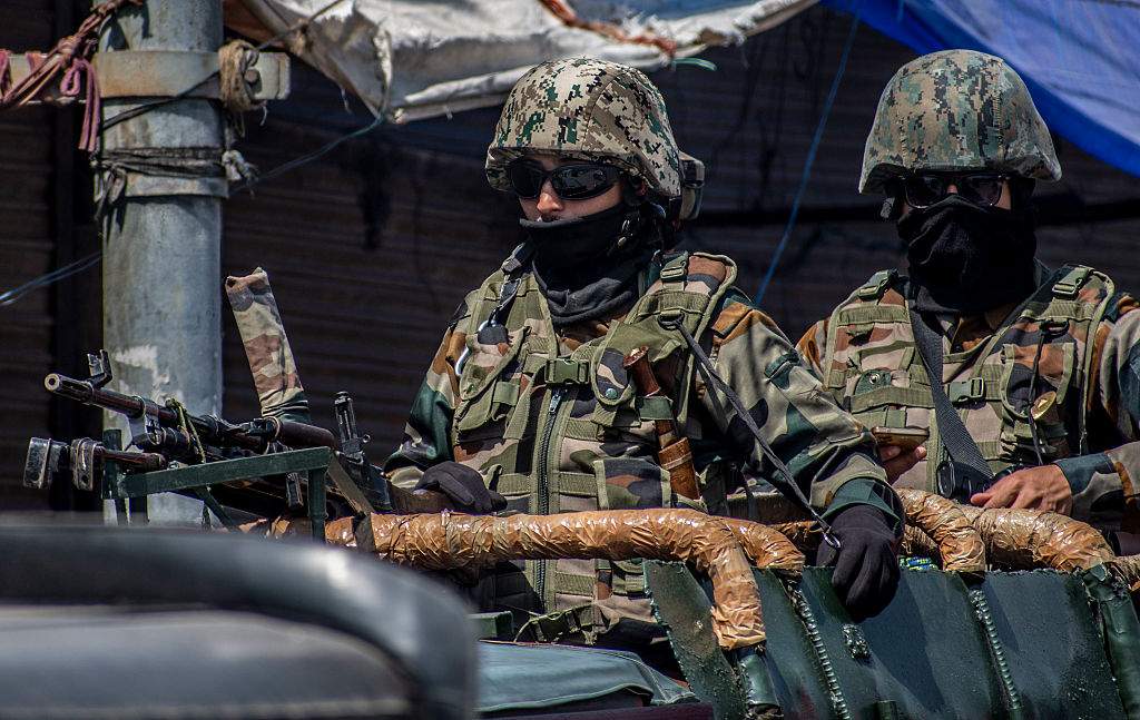 Indian army soldiers stand guard atop their vehicle, following an attack on Indian tourists by gunmen on April 23, 2025 in Srinagar, India.