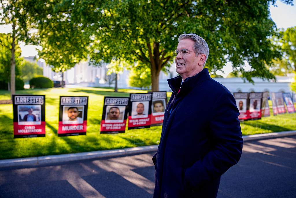 Posters depicting detained illegal immigrants are visible as U.S. Treasury Secretary Scott Bessent arrives for a television interview outside the West Wing of the White House on April 28, 2025 in Washington, D.C.