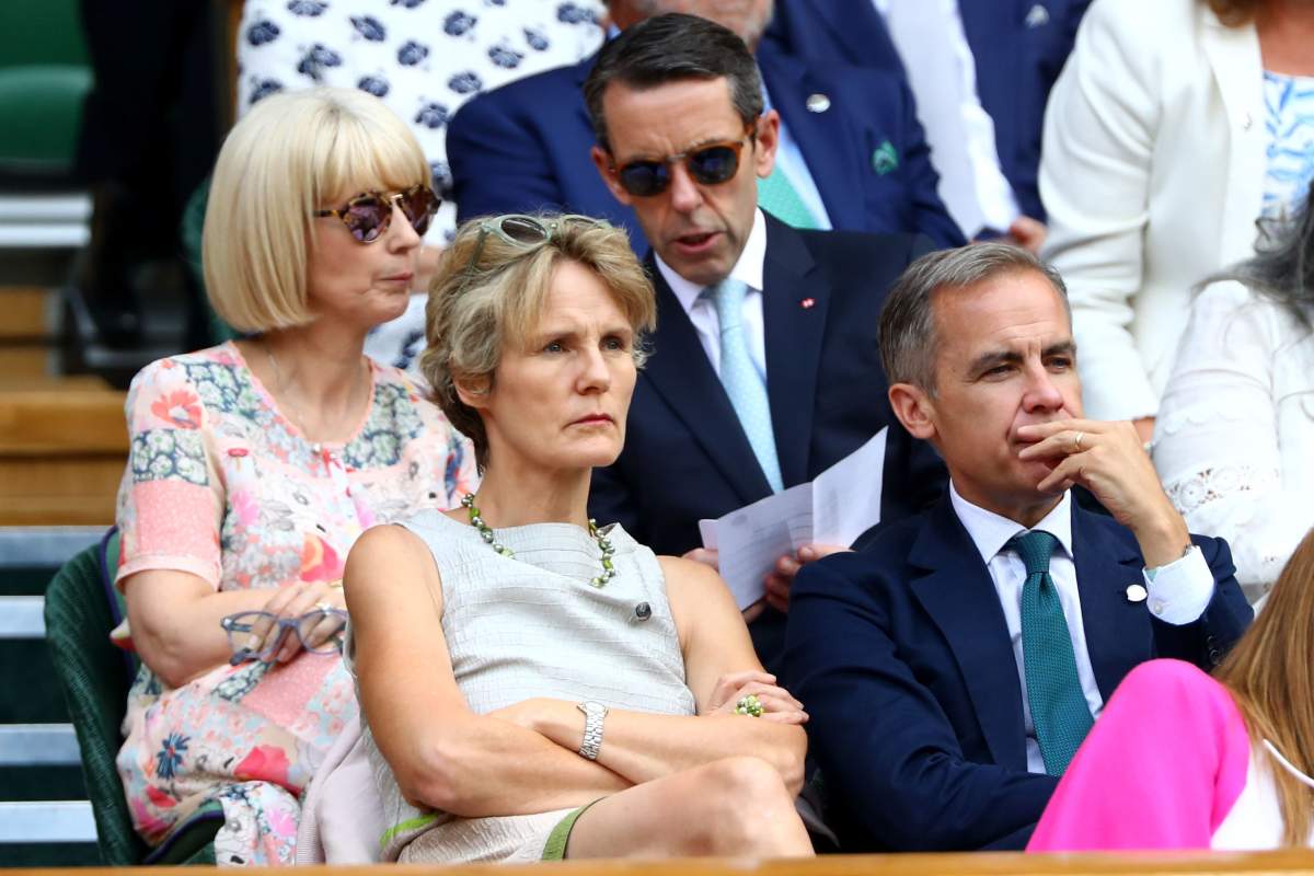 Then governor of the Bank of England Mark Carney (R) and his wife Diana Fox Carney attend the Wimbledon Lawn Tennis Championships at All England Lawn Tennis and Croquet Club on July 13, 2018.