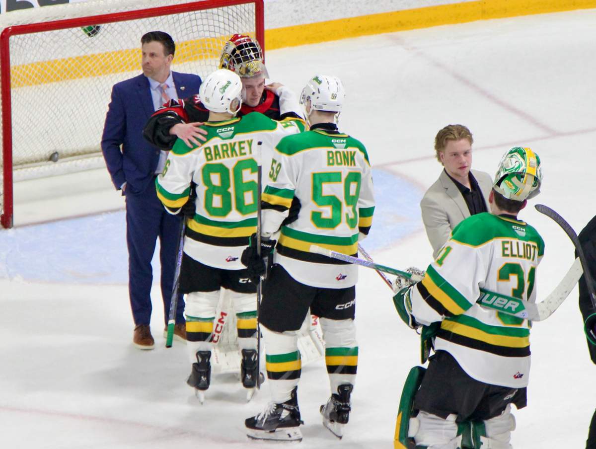 Denver Barkey and Oliver Bonk of the London Knights meet Carter George of the Owen Sound Attack in the handshake line after an 8-4 win by London gave the Knights a 4-0 series win over Owen Sound on Apr. 3, 2025 at the Harry Lumley Bayshore Community Centre.