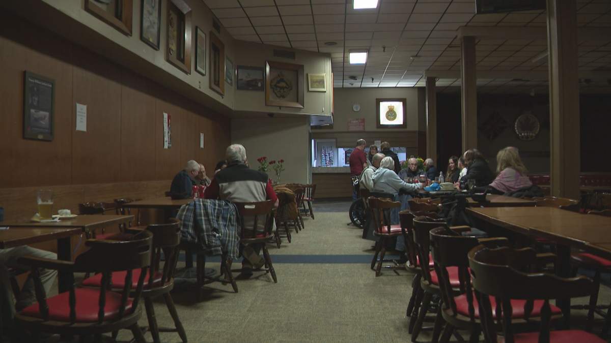 Members sit in the hall of the legion.