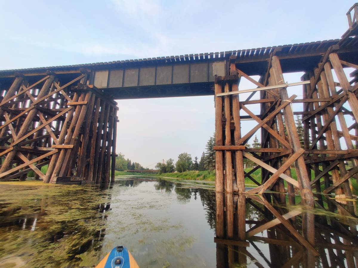 File photo of paddleboarding on the Sturgeon River near the train trestle bridge in St. Albert, Alta. in the summer of 2023.