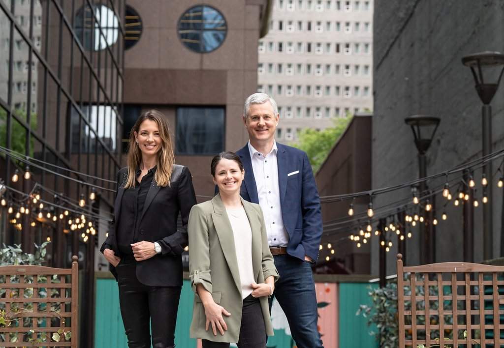 Diana Matheson, centre, former Canadian soccer player and CEO of Project 8 behind the creation of the Canadian Women's Professional Soccer League is flanked by co-founders Isabele Chevalier, left and Jean-Francois Crevier in Montreal on May 27, 2024.