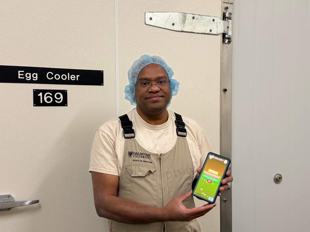 Suresh Neethirajan, a professor with Dalhousie University, holding the Cluckify app.