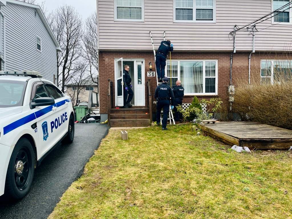 Halifax Regional Police are investigating a homicide after a man was fatally shot in Dartmouth on March 31, 2025. Officers are seen in this photo collecting evidence the next day at a home on Ancona Place.