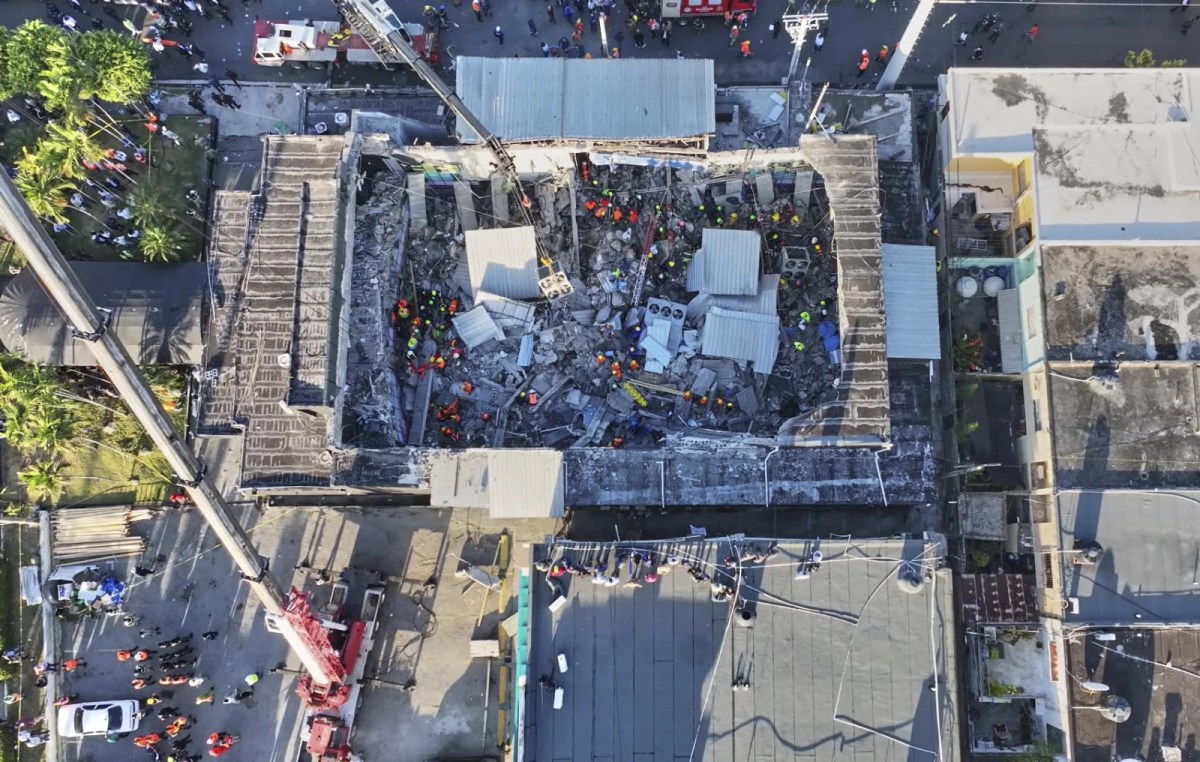 Rescue workers search for survivors at the Jet Set nightclub after its roof collapsed during a merengue concert in Santo Domingo, Dominican Republic, Tuesday, April 8, 2025.