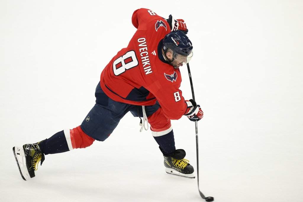 Washington Capitals left wing Alex Ovechkin (8) shoots during the third period of an NHL hockey game against the Buffalo Sabres, Sunday, March 30, 2025, in Washington.