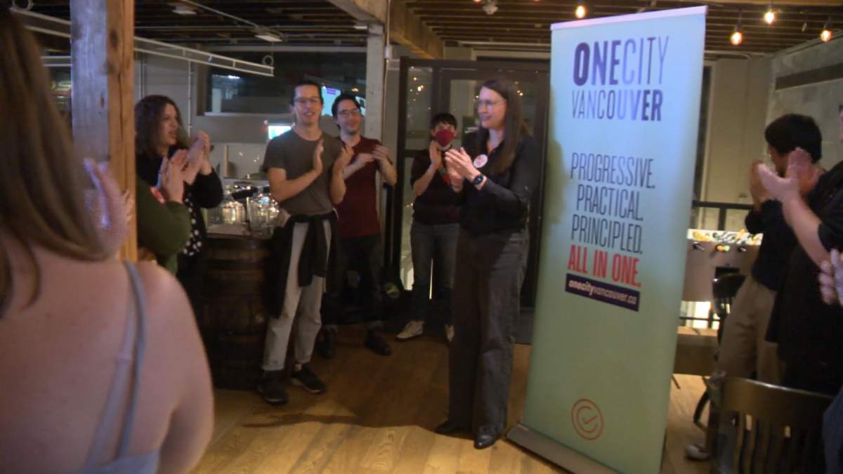 One City's Lucy Mahoney celebrates her victory with supporters in one of two civic byelections in Vancouver on Saturday.