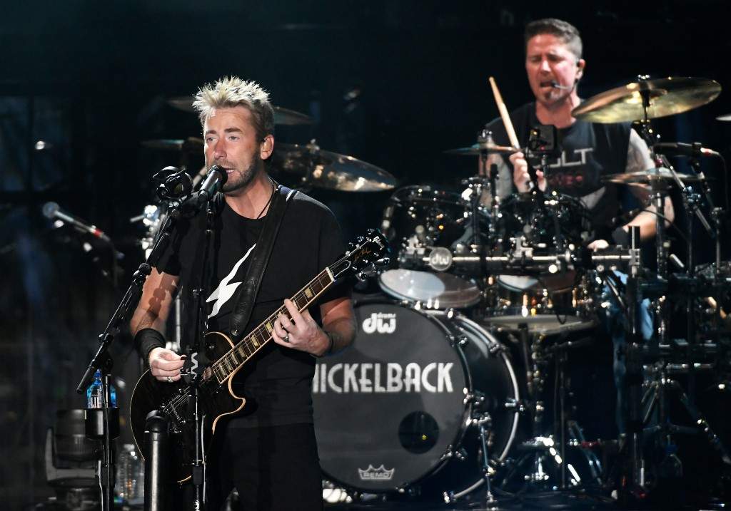 Chad Kroeger (L) and Daniel Adair of Nickelback perform during the band's Get Rollin' tour at Toyota Amphitheatre on July 08, 2023 in Wheatland, California.