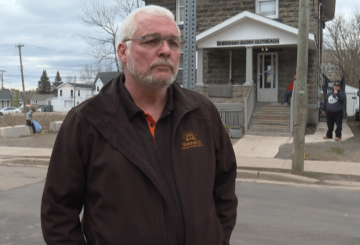 Founding Director Cal Maskery stands in front one of the buildings for the ShekinahGO treatment centre.