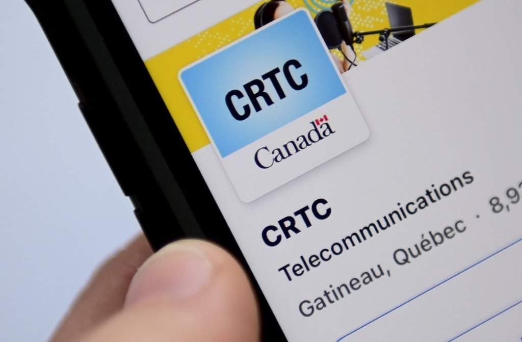 A person navigates to the on-line social-media pages of the Canadian Radio-television and Telecommunications Commission (CRTC) in Ottawa on Monday, May 17, 2021. THE CANADIAN PRESS/Sean Kilpatrick.