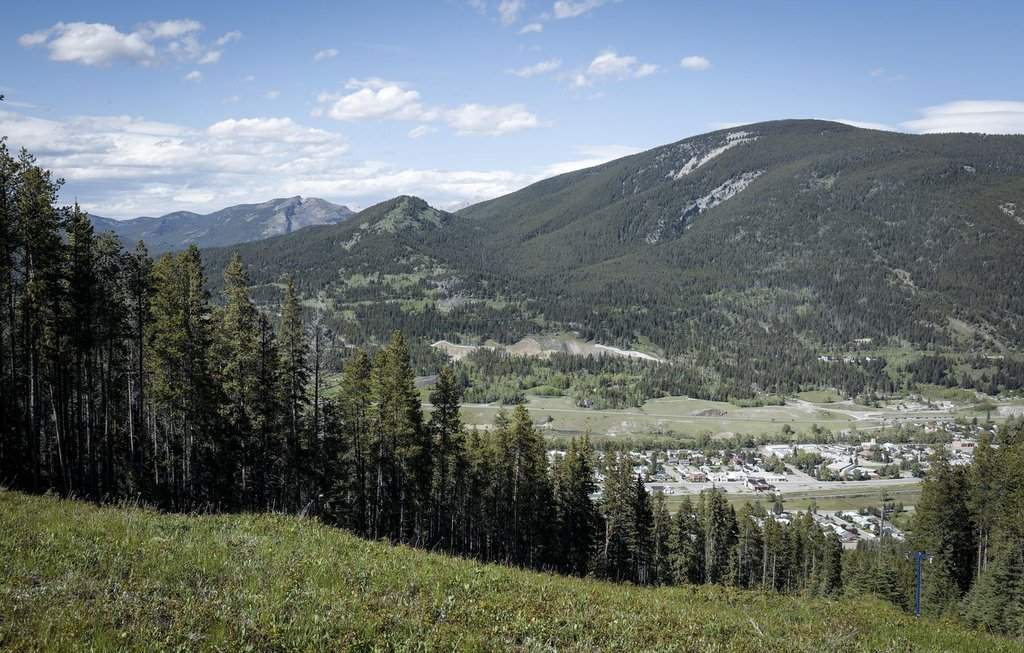 Grassy Mountain, peak to left, and the Grassy Mountain Coal Project are seen north of Blairmore, Alta., Thursday, June 6, 2024.