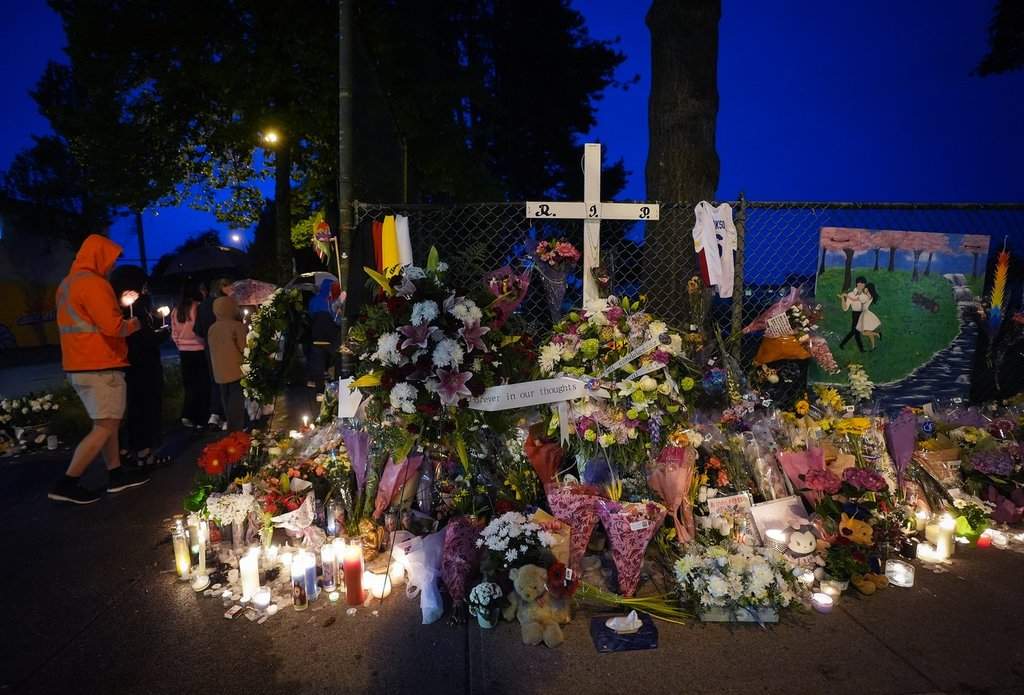 People hold a candlelight march during a vigil on the street where a vehicle-ramming attack occurred at the Filipino community’s Lapu Lapu Day festival last week, on a provincial day of mourning for the victims, in Vancouver, on Friday, May 2, 2025.
