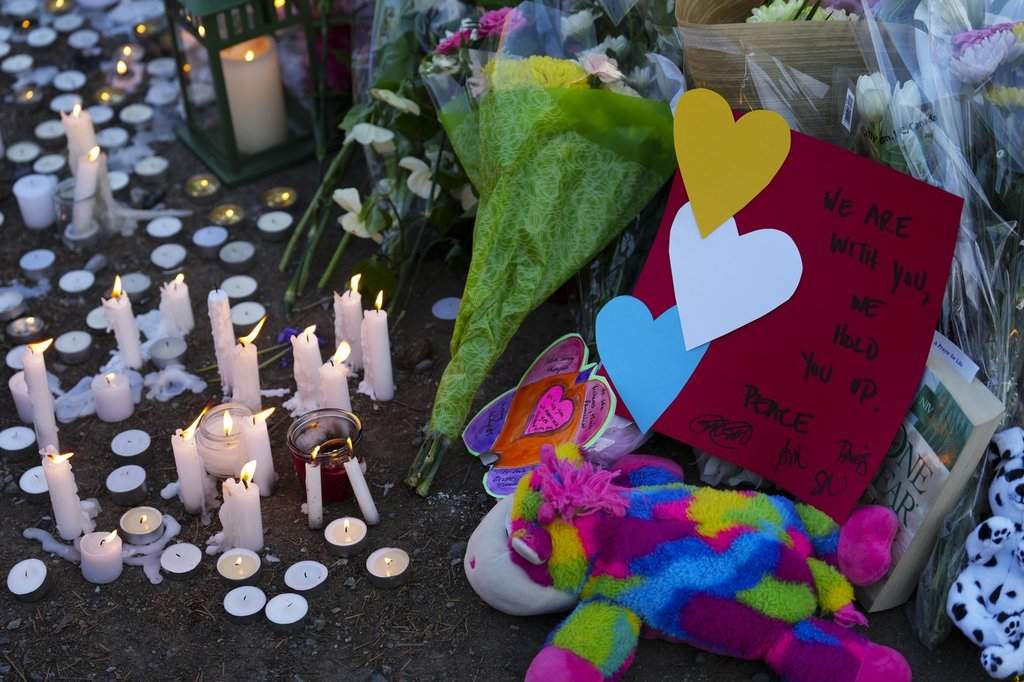 Candles burn at a memorial for the Lapu Lapu Day block party tragedy in Vancouver, B.C., on Sunday, April 27, 2025.