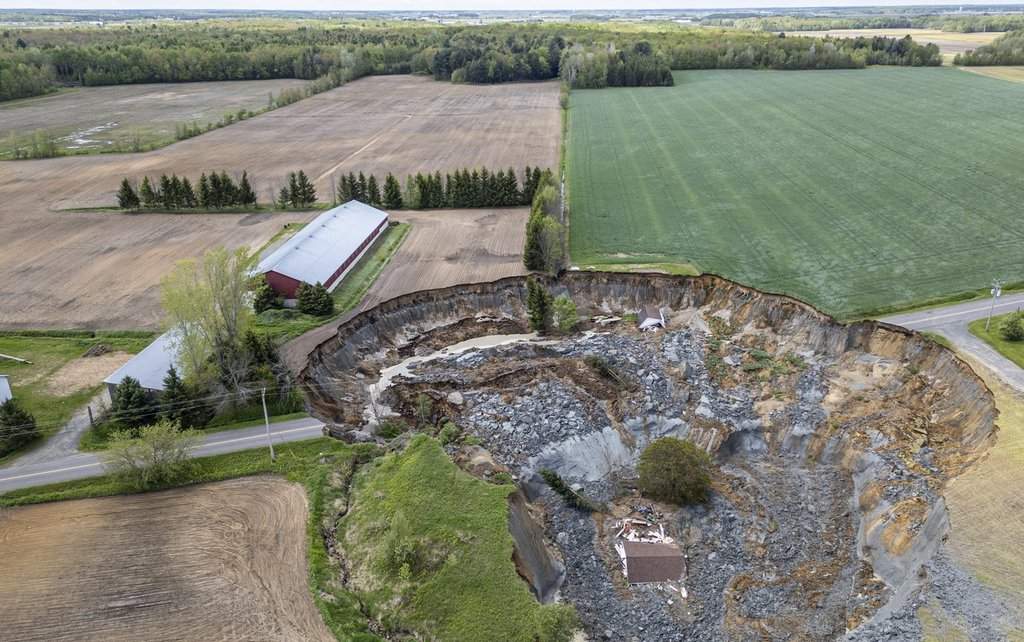 A home is seen after being swept away by a major landslide in Ste-Monique, Que., northeast of Montreal.