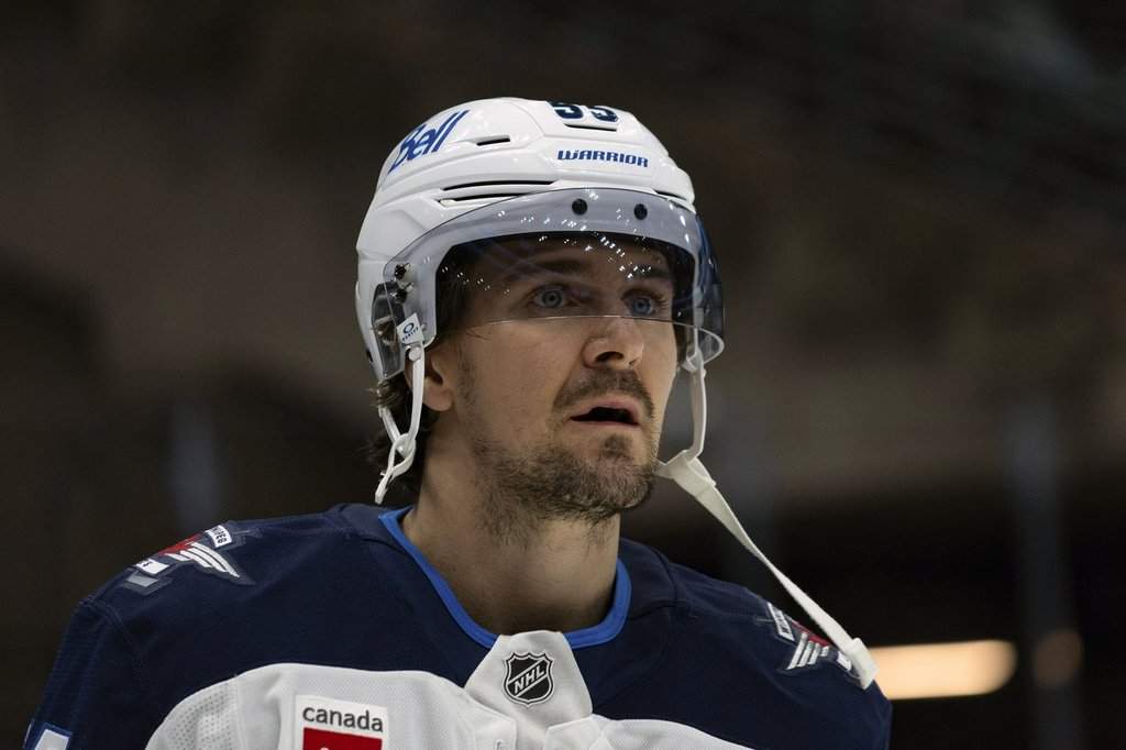 Winnipeg Jets centre Mark Scheifele stands on the ice during warm-ups before an NHL hockey game against the Utah Hockey Club, Monday, Jan. 20, 2025, in Salt Lake City. (AP Photo/Melissa Majchrzak).