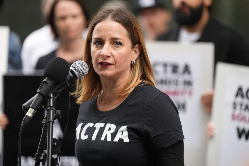 Actor Eleanor Noble and National President of ACTRA. the Alliance of Canadian Cinema Television Radio Artists (ACTRA) speaks as union members join representatives from the Screen Actors Guild — American Federation of Television and Radio Artists (SAG-AFTRA) as they hold a joint rally outside the Canadian headquarters of Amazon and Apple in Toronto, Saturday, Sept. 9, 2023, to protest corporate greed that is diminishing the livelihoods of their members.
