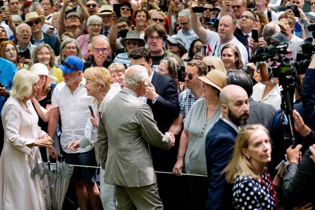 King Charles, centre, and Queen Camilla, left, meet with the crowd following a tree planting ceremony at Rideau Hall in Ottawa, on Monday, May 26, 2025. THE CANADIAN PRESS/Spencer Colby