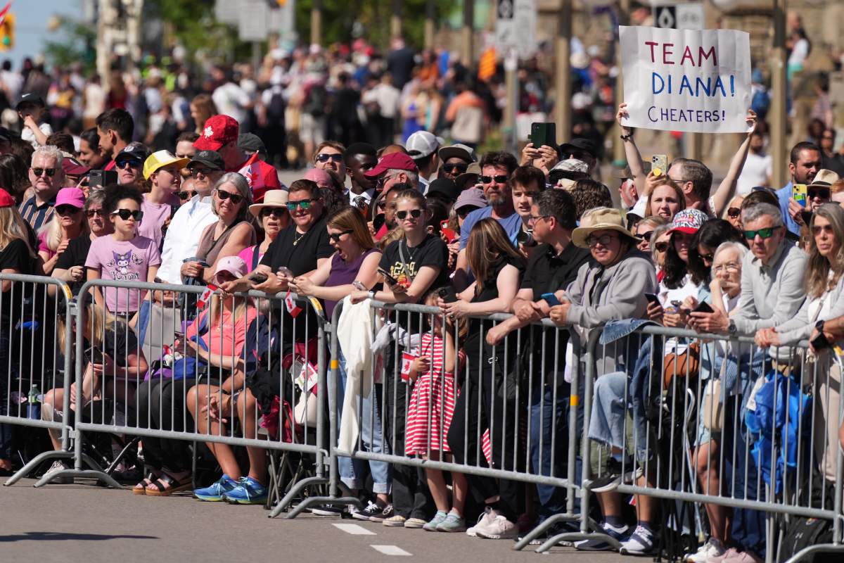 Crowds of people wait for the arrival of King Charles and Queen Camilla in Ottawa during a royal visit on Tuesday, May 27, 2025. THE CANADIAN PRESS/Christinne Muschi
