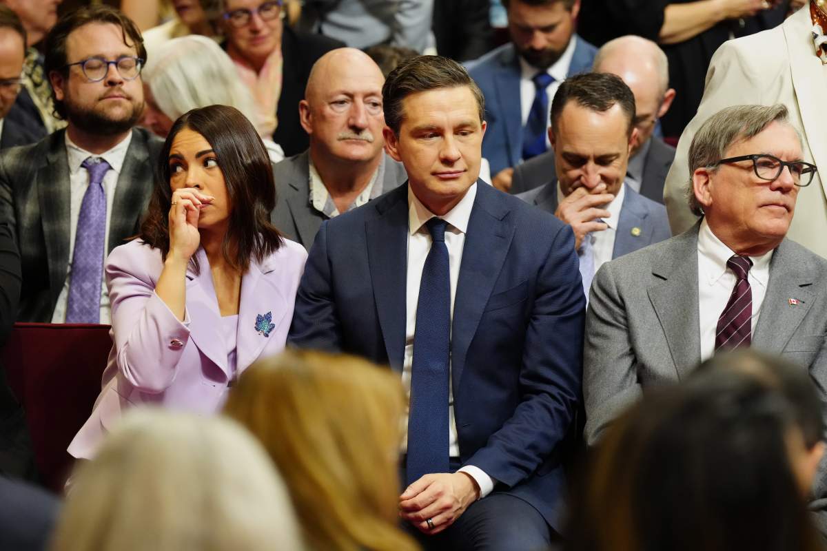 Conservative Leader Pierre Poilievre and his wife Anaida Poilievre are shown ahead of King Charles delivering the speech from the throne in the Senate in Ottawa on Tuesday, May 27, 2025. THE CANADIAN PRESS/Chris Young