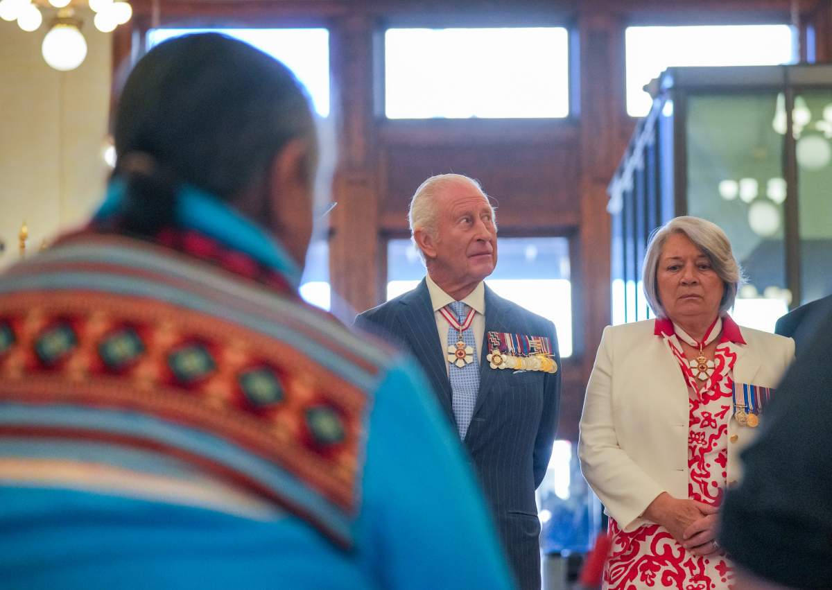 King Charles and Gov. Gen. Mary Simon watch a drum performance as they arrive at the Senate of Canada Building in Ottawa on Tuesday, May 27, 2025. THE CANADIAN PRESS/Chris Tanouye