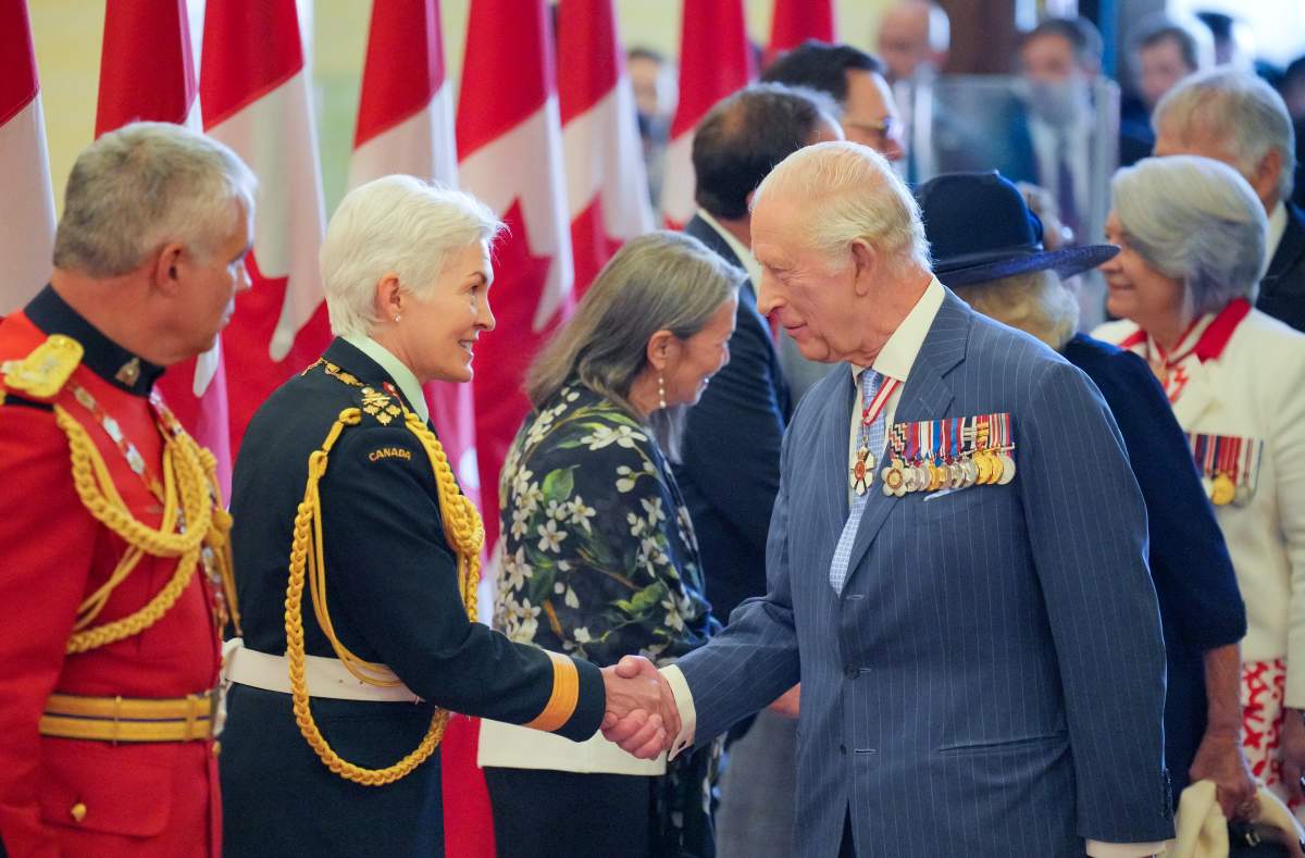 The Chief of the Defence Staff, Gen. Jennie Carignan, greets King Charles as they arrive at the Senate of Canada Building in Ottawa on May 27, 2025.