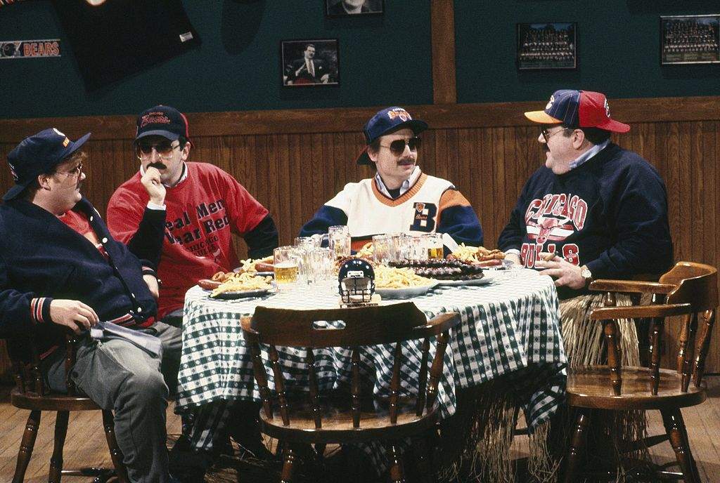 Pictured: (L-R) Chris Farley as Todd O'Connor, Robert Smigel as Carl Wollarski, Mike Myers as Pat Arnold, George Wendt as Bob Swerski during "Bill Swerski's Super Fans" skit on SNL in 1991.