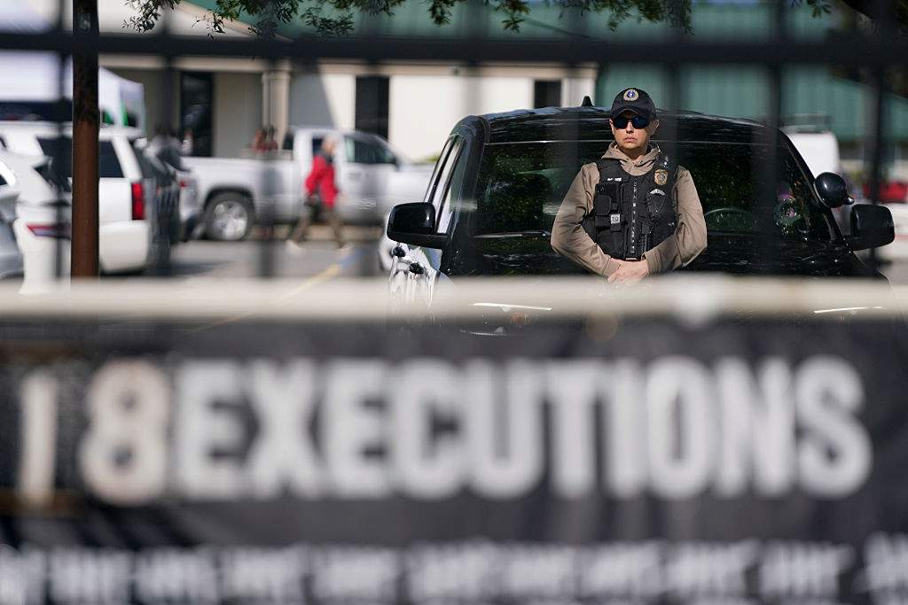 A member of law enforcement stands near a vehicle at the department of corrections before the scheduled firing squad execution of South Carolina inmate Mikal Mahdi on April 11, 2025 in Columbia, South Carolina.