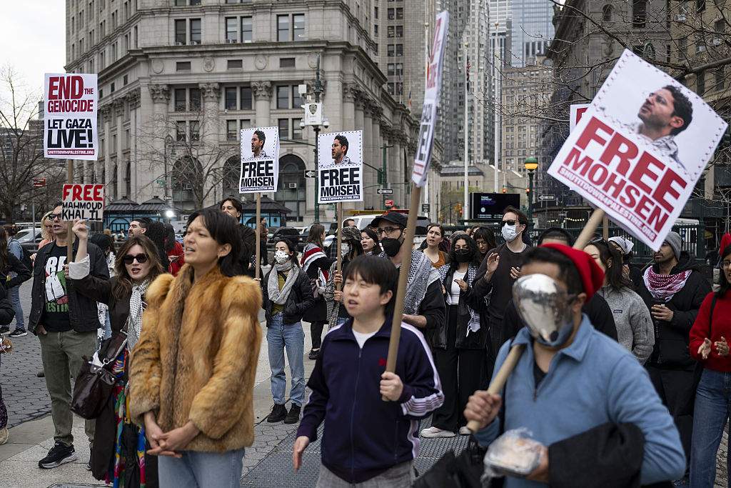 People take part in a protest to demand the release of Palestinian activist and Columbia University student Mohsen Mahdawi.
