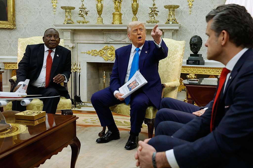 (L-R) South Africa President Cyril Ramaphosa, U.S. President Donald Trump and Defense Secretary Pete Hegseth and Commerce Secretary Howard Lutnik speak to journalists in the Oval Office at the White House on May 21, 2025 in Washington, DC.