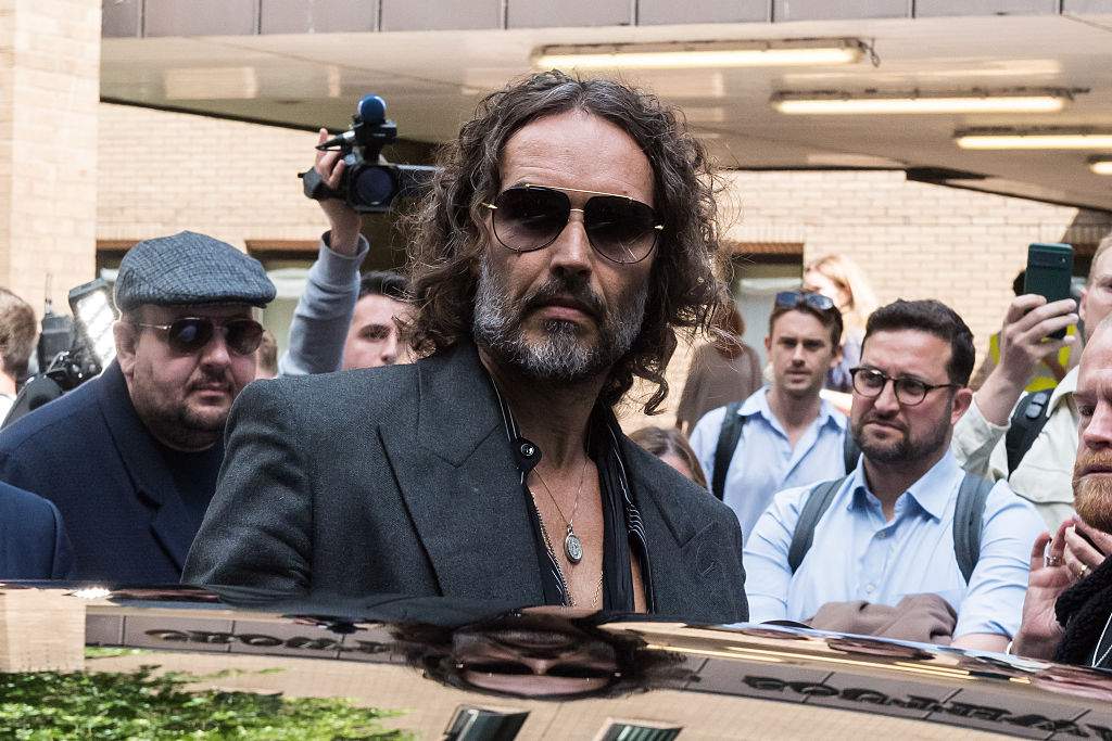 British comedian Russell Brand leaves Southwark Crown Court followed a plea and trial preparation hearing after being charged with rape, oral rape, indecent assault and two counts of sexual assault, between 1999 and 2005 in Bournemouth and the Westminster area in London, United Kingdom on May 30, 2025.