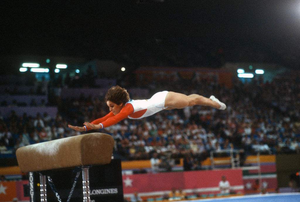 Gymnast Mary Lou Retton of the United States competes in the vault competition in gymnastics during the Games of the XXIII Olympiad in the 1984 Summer Olympics circa 1984 at UCLA's Pauley Pavilion in Los Angeles, California.