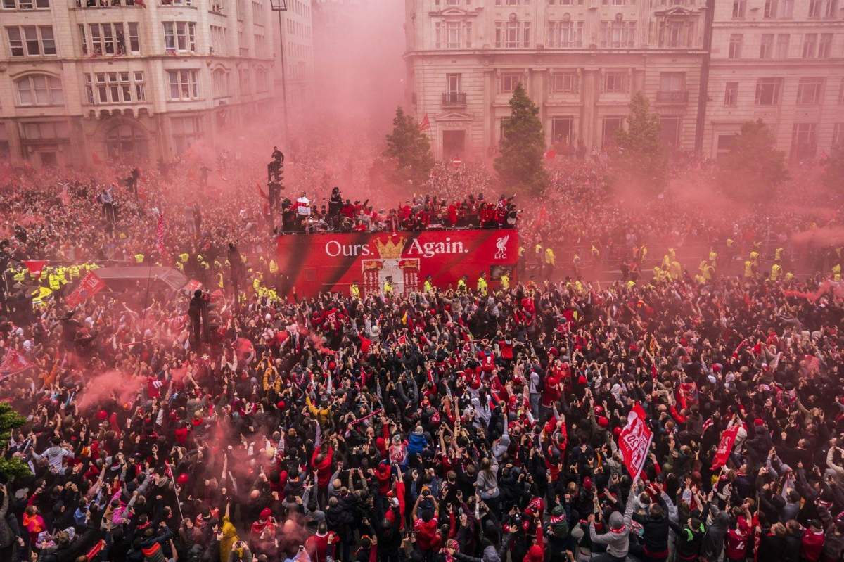 Crowds greet the Liverpool soccer team during their Premier League winners parade in Liverpool, England, Monday, May 26, 2025. (Owen Humphreys/PA via AP)