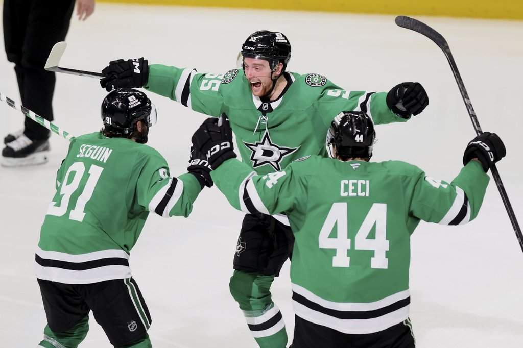 Dallas Stars' Tyler Seguin (91), Thomas Harley (55) and Cody Ceci (44) celebrate after Harley scored in overtime in Game 6 of a second-round NHL hockey playoff series against the Winnipeg Jets in Dallas, Saturday, May 17, 2025. (AP Photo/Gareth Patterson)