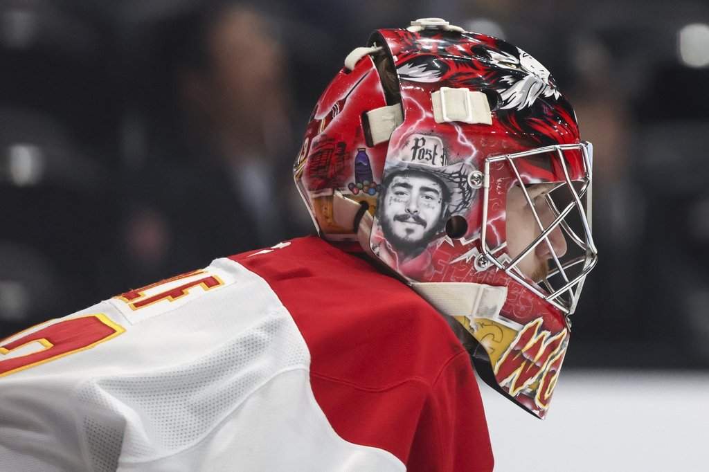 Calgary Flames goalie Dustin Wolf reacts during the first period of an NHL hockey game against the Anaheim Ducks, Wednesday, April 9, 2025, in Anaheim, Calif.